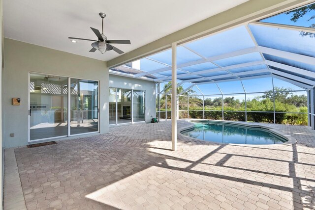 13783 Palmetto Point Ct, Port Charlotte, FL 33953 - swimming pool with a patio area, a ceiling fan, and glass enclosure