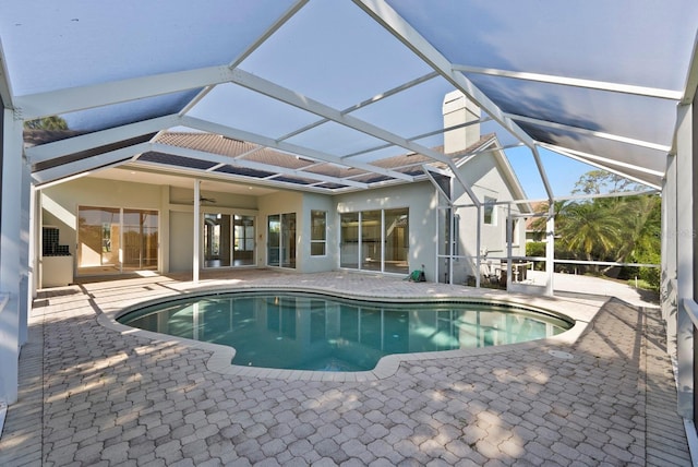 13783 Palmetto Point Ct, Port Charlotte, FL 33953 - swimming pool with a patio area, ceiling fan, and a lanai
