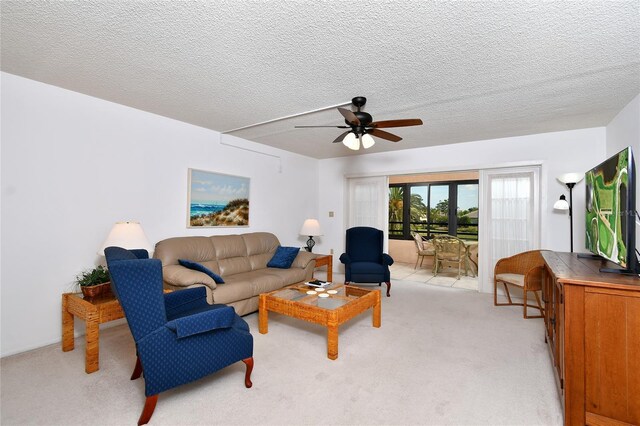 601 Islamorada Blvd Unit 24B, Punta Gorda, FL 33955 - living room with light colored carpet, ceiling fan, and a textured ceiling