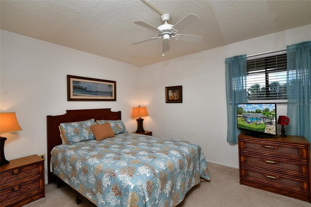 601 Islamorada Blvd Unit 24B, Punta Gorda, FL 33955 - bedroom with carpet flooring, ceiling fan, and a textured ceiling