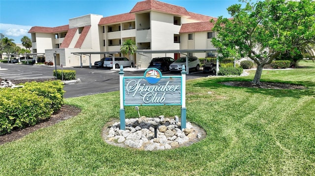 601 Islamorada Blvd Unit 24B, Punta Gorda, FL 33955 - community / neighborhood sign featuring covered parking and a yard