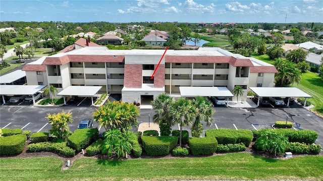 601 Islamorada Blvd Unit 24B, Punta Gorda, FL 33955 - view of building exterior featuring covered and uncovered parking