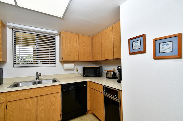 601 Islamorada Blvd Unit 24B, Punta Gorda, FL 33955 - kitchen featuring black appliances, a sink, and light countertops