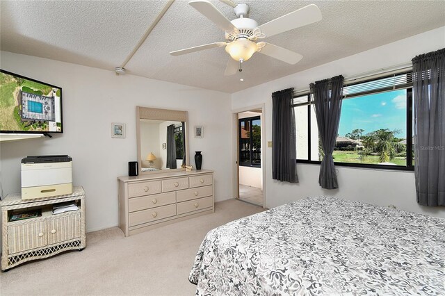 601 Islamorada Blvd Unit 24B, Punta Gorda, FL 33955 - carpeted bedroom featuring a textured ceiling and a ceiling fan