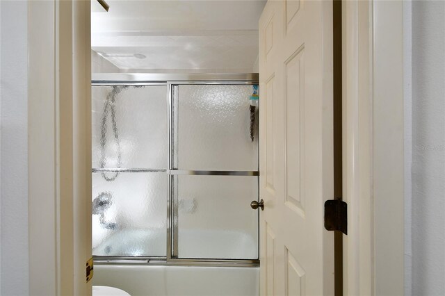 601 Islamorada Blvd Unit 24B, Punta Gorda, FL 33955 - full bathroom featuring shower / bath combination with glass door and toilet