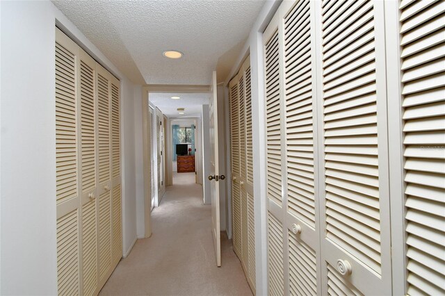 601 Islamorada Blvd Unit 24B, Punta Gorda, FL 33955 - hallway with carpet, recessed lighting, and a textured ceiling