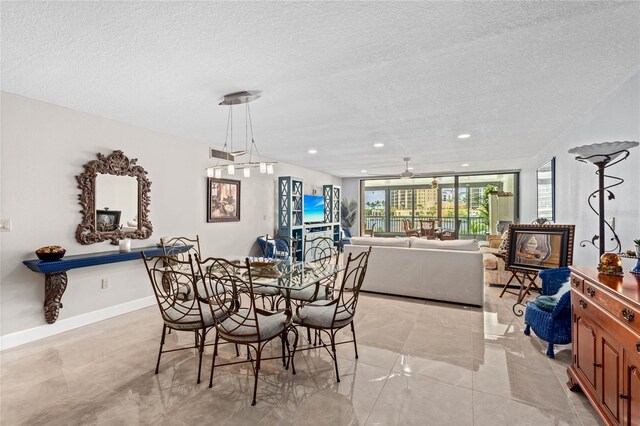 3250 Southshore Dr Unit 54B, Punta Gorda, FL 33955 - dining area featuring a textured ceiling, recessed lighting, and baseboards