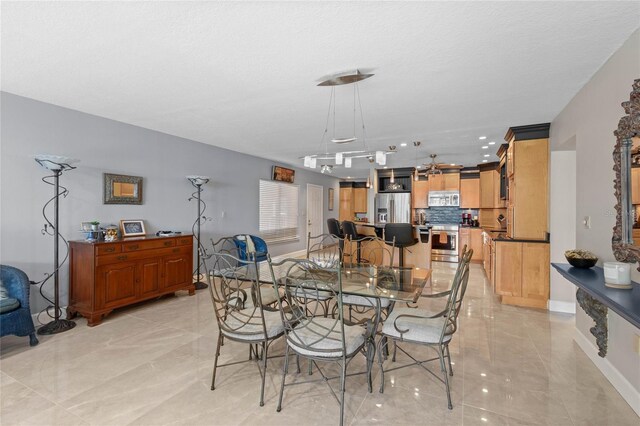 3250 Southshore Dr Unit 54B, Punta Gorda, FL 33955 - dining room with light marble finish floors and baseboards