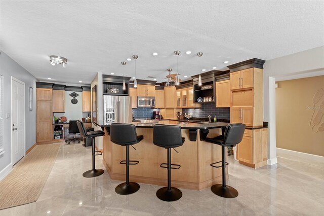 3250 Southshore Dr Unit 54B, Punta Gorda, FL 33955 - kitchen featuring appliances with stainless steel finishes, dark countertops, backsplash, light brown cabinets, and baseboards
