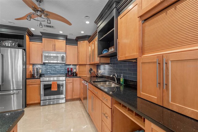 3250 Southshore Dr Unit 54B, Punta Gorda, FL 33955 - kitchen with appliances with stainless steel finishes, open shelves, a sink, ceiling fan, and decorative backsplash
