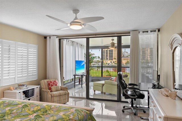 3250 Southshore Dr Unit 54B, Punta Gorda, FL 33955 - bedroom featuring access to outside, an office area, and a textured ceiling