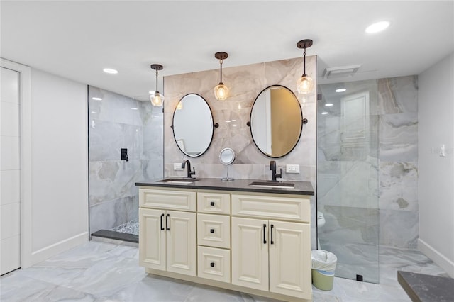 3250 Southshore Dr Unit 54B, Punta Gorda, FL 33955 - bathroom with marble finish flooring, double vanity, a walk in shower, baseboards, and recessed lighting