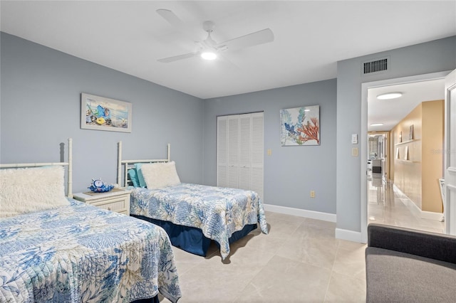 3250 Southshore Dr Unit 54B, Punta Gorda, FL 33955 - bedroom featuring light tile patterned floors, a closet, a ceiling fan, and baseboards