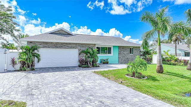 192 Danforth Dr S, Port Charlotte, FL 33980 - single story home with decorative driveway, an attached garage, stone siding, and roof with shingles