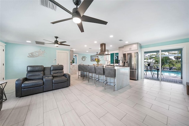 192 Danforth Dr S, Port Charlotte, FL 33980 - living room featuring ceiling fan, recessed lighting, and ornamental molding