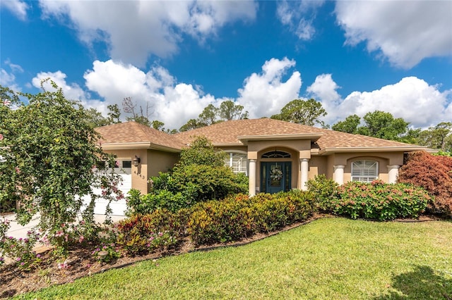 4443 Abcor Rd, North Port, FL 34286 - mediterranean / spanish-style house with stucco siding and a front yard