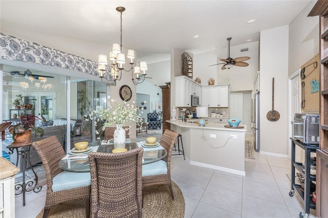 4443 Abcor Rd, North Port, FL 34286 - dining space featuring a ceiling fan, a chandelier, light tile patterned floors, and vaulted ceiling