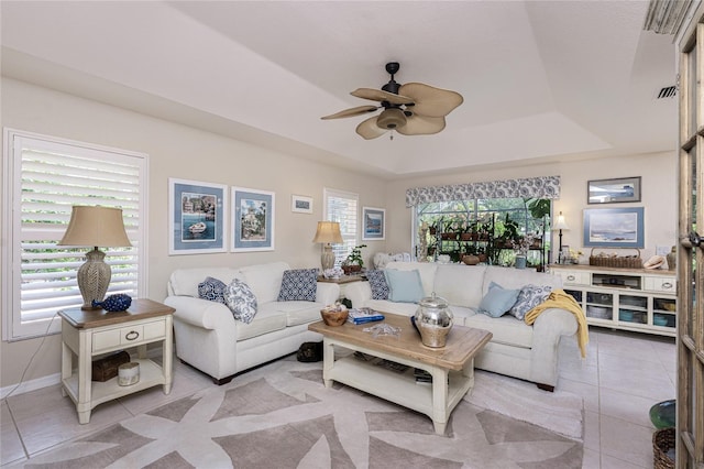 4443 Abcor Rd, North Port, FL 34286 - living area with ceiling fan, a raised ceiling, and light tile patterned floors
