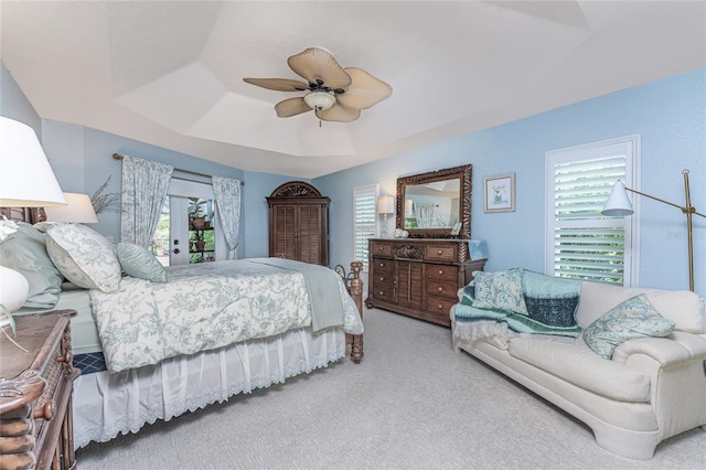 4443 Abcor Rd, North Port, FL 34286 - carpeted bedroom with a tray ceiling, access to exterior, ceiling fan, and french doors