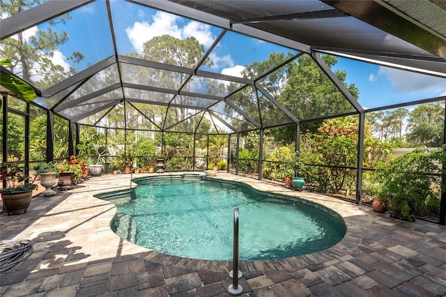 4443 Abcor Rd, North Port, FL 34286 - swimming pool with a patio and glass enclosure