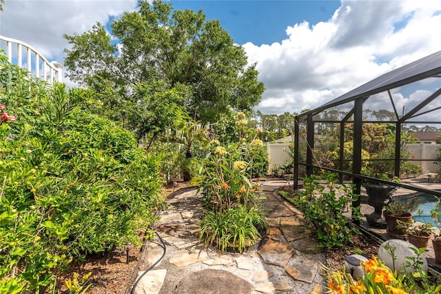 4443 Abcor Rd, North Port, FL 34286 - view of yard featuring a patio and glass enclosure