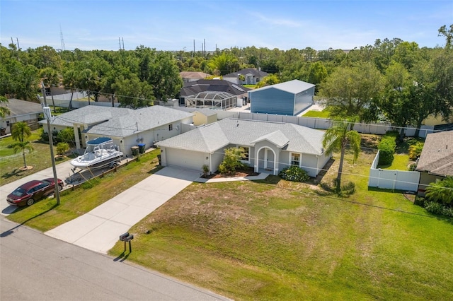 3886 Cincinnati St, North Port, FL 34286 - view of front facade featuring driveway, an attached garage, a residential view, and stucco siding