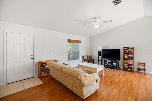 3886 Cincinnati St, North Port, FL 34286 - living room with light wood-style flooring, lofted ceiling, a ceiling fan, and baseboards