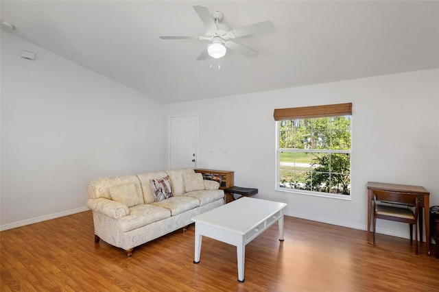 3886 Cincinnati St, North Port, FL 34286 - living room with wood finished floors, baseboards, ceiling fan, and lofted ceiling
