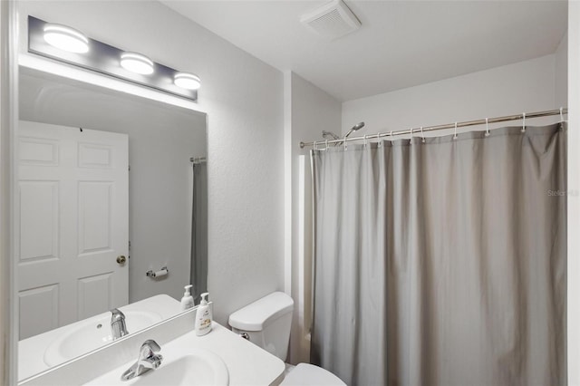 3886 Cincinnati St, North Port, FL 34286 - bathroom featuring toilet, vanity, and a shower with shower curtain
