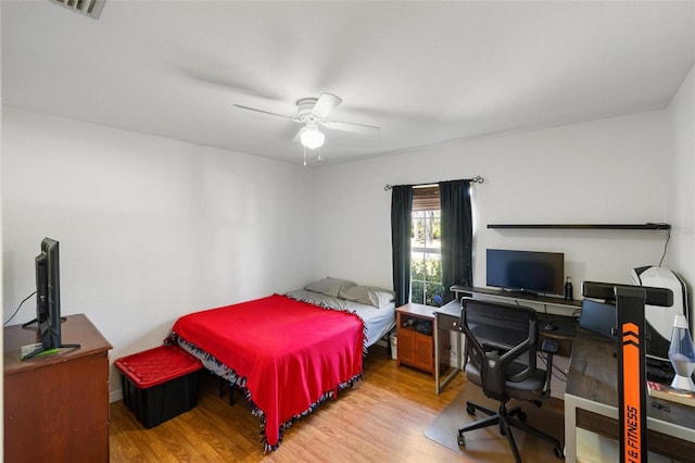 3886 Cincinnati St, North Port, FL 34286 - bedroom with wood finished floors, a ceiling fan, and an office area