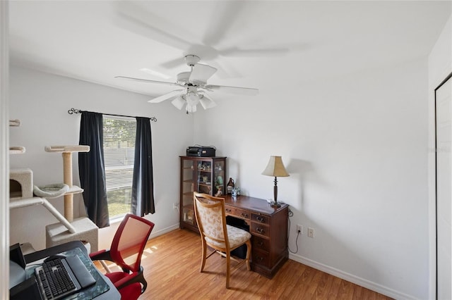 3886 Cincinnati St, North Port, FL 34286 - office area with light wood-style floors, ceiling fan, and baseboards