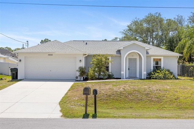 3886 Cincinnati St, North Port, FL 34286 - ranch-style home featuring stucco siding, an attached garage, and concrete driveway