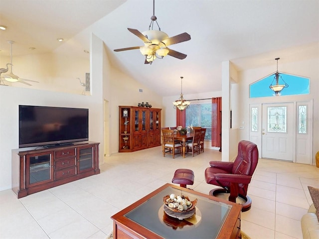 3518 Terin Ct, Punta Gorda, FL 33950 - living area with a ceiling fan, light tile patterned floors, a chandelier, and high vaulted ceiling