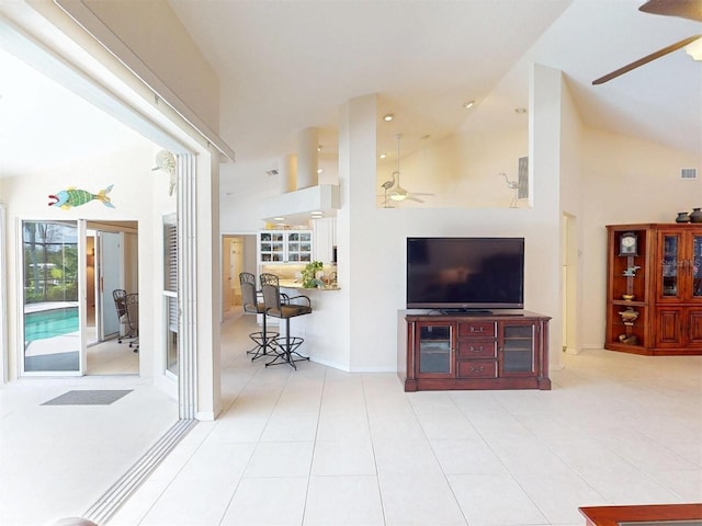 3518 Terin Ct, Punta Gorda, FL 33950 - living room with ceiling fan, high vaulted ceiling, tile patterned flooring, and baseboards