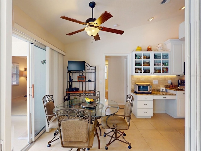 3518 Terin Ct, Punta Gorda, FL 33950 - dining area with ceiling fan, light tile patterned floors, and vaulted ceiling