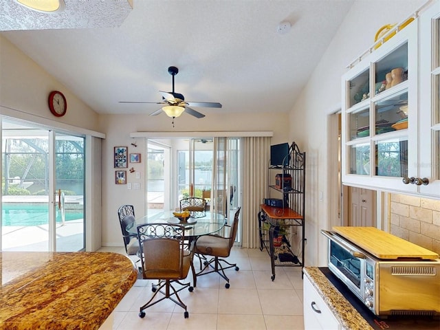 3518 Terin Ct, Punta Gorda, FL 33950 - dining area featuring vaulted ceiling, ceiling fan, and light tile patterned floors