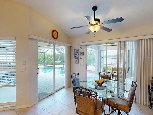3518 Terin Ct, Punta Gorda, FL 33950 - dining space with ceiling fan, vaulted ceiling, light tile patterned flooring, and baseboards