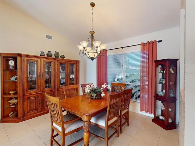 3518 Terin Ct, Punta Gorda, FL 33950 - dining space featuring a chandelier, vaulted ceiling, and light tile patterned floors