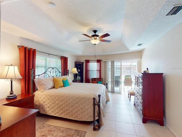3518 Terin Ct, Punta Gorda, FL 33950 - bedroom with a raised ceiling, access to exterior, light tile patterned floors, baseboards, and ceiling fan