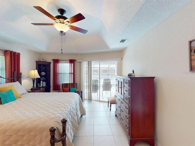 3518 Terin Ct, Punta Gorda, FL 33950 - bedroom with access to exterior, a raised ceiling, multiple windows, and a ceiling fan