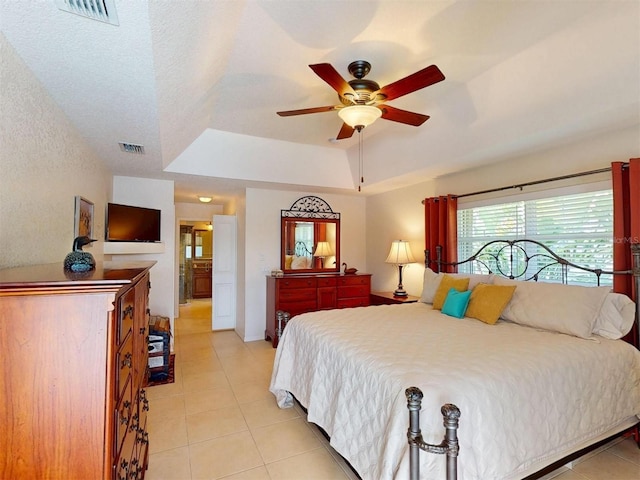 3518 Terin Ct, Punta Gorda, FL 33950 - bedroom with light tile patterned flooring, a raised ceiling, and ceiling fan