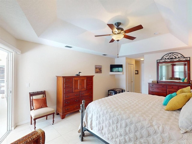 3518 Terin Ct, Punta Gorda, FL 33950 - bedroom with a raised ceiling, light tile patterned flooring, and a ceiling fan