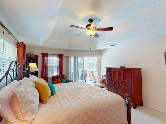 3518 Terin Ct, Punta Gorda, FL 33950 - bedroom featuring access to exterior, light tile patterned floors, a ceiling fan, a raised ceiling, and baseboards