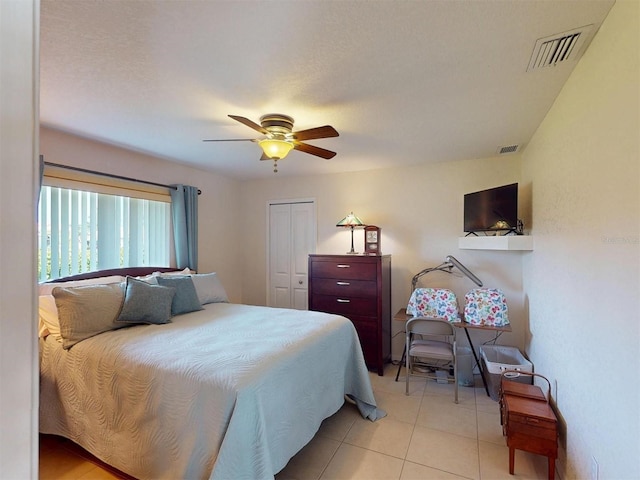 3518 Terin Ct, Punta Gorda, FL 33950 - bedroom with a ceiling fan, light tile patterned flooring, and a closet