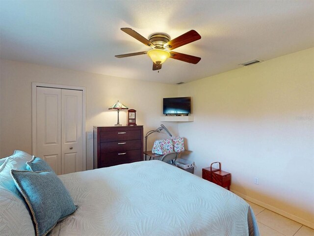 3518 Terin Ct, Punta Gorda, FL 33950 - tiled bedroom with a closet, ceiling fan, and baseboards