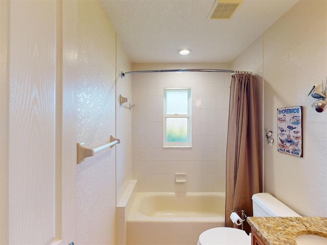 3518 Terin Ct, Punta Gorda, FL 33950 - full bathroom with toilet, shower / bath combo with shower curtain, vanity, and a textured wall