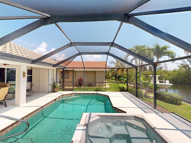 3518 Terin Ct, Punta Gorda, FL 33950 - view of pool featuring a patio area, a water view, a pool with connected hot tub, and a lanai