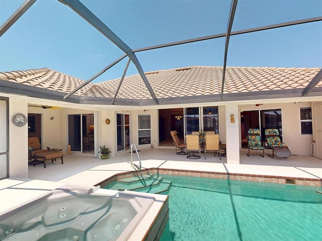 3518 Terin Ct, Punta Gorda, FL 33950 - back of property with a patio, a tiled roof, an outdoor hot tub, a lanai, and an outdoor pool