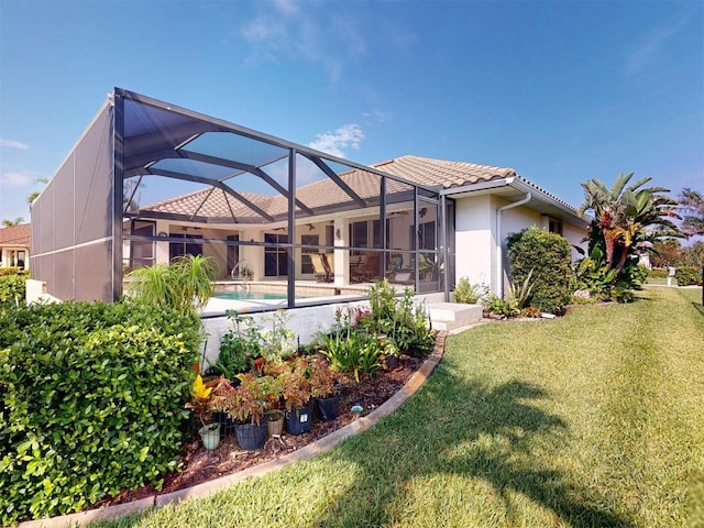 3518 Terin Ct, Punta Gorda, FL 33950 - back of property with a lawn, a tile roof, an outdoor pool, stucco siding, and a lanai