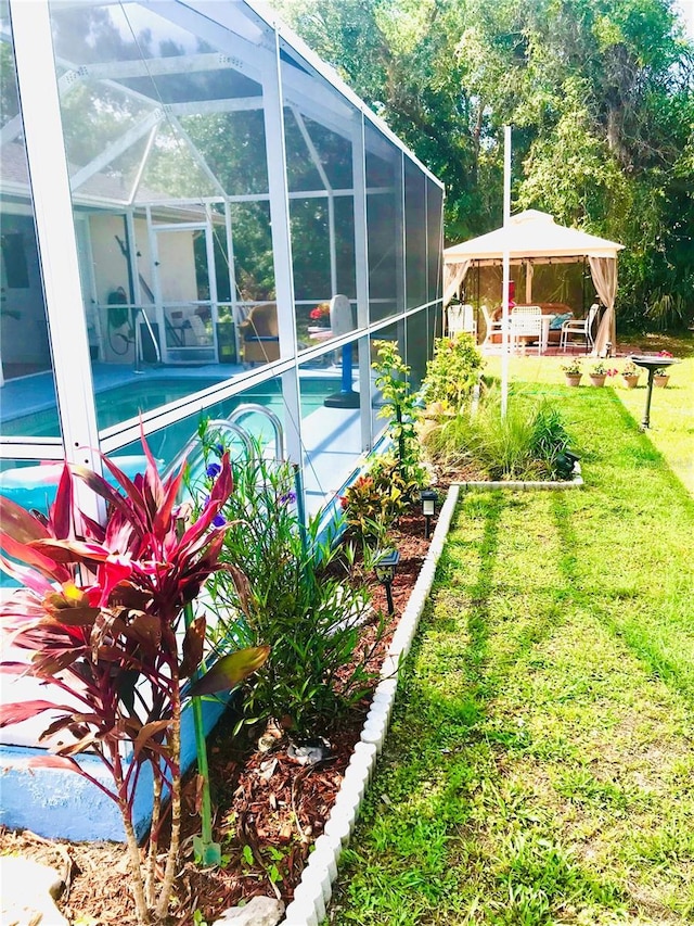 1017 Guild St, Port Charlotte, FL 33952 - swimming pool with a gazebo, a lawn, and a patio area